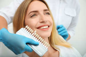 Women comparing tooth colour representing the power of cosmetic dentistry