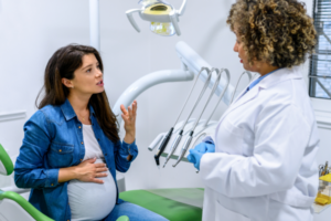 pregnant women in dentist appointments for check up on healthy teeth during pregnancy